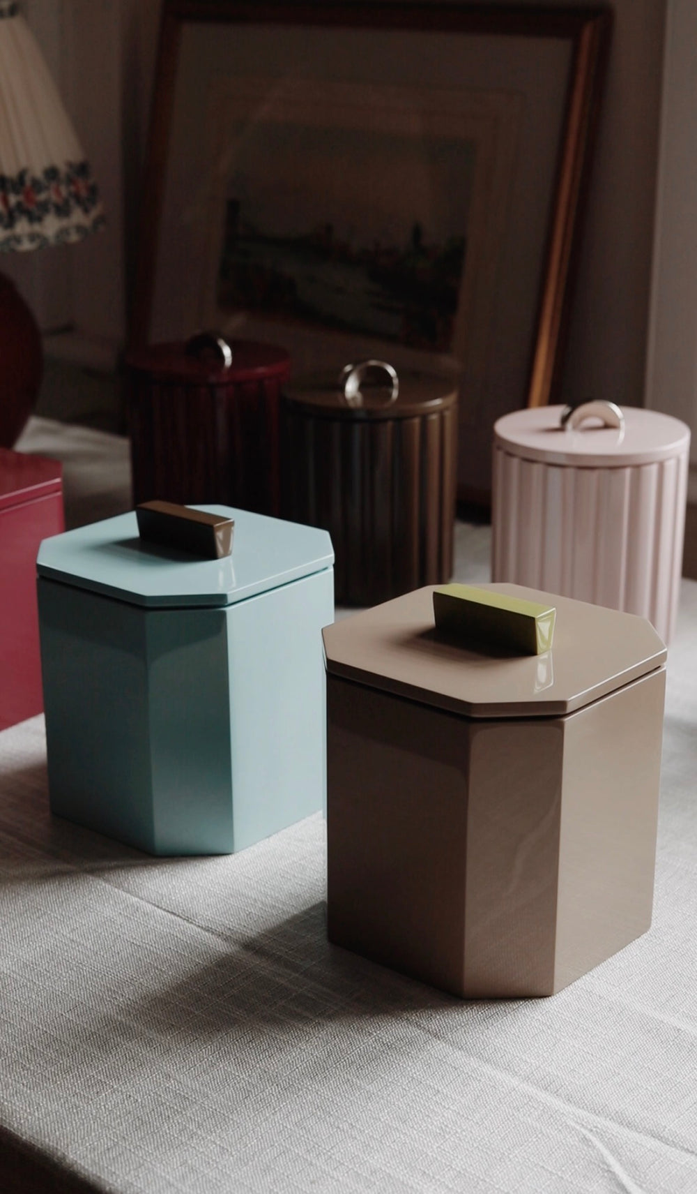 Close-up of Vinidec high-gloss fluted and octagonal lacquer ice buckets styled in an elegant home interior. Perfect for hosting